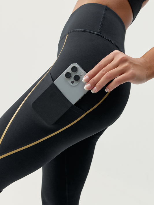 Gold-schwarze Leggings